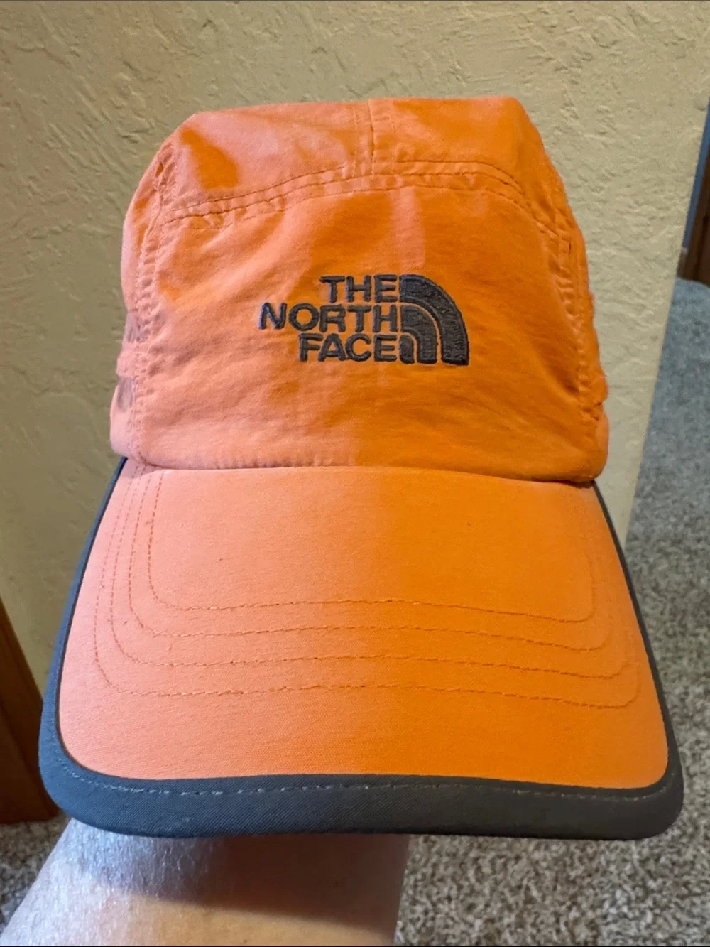The North Face Orange Men's Trail Hat with Black Logo